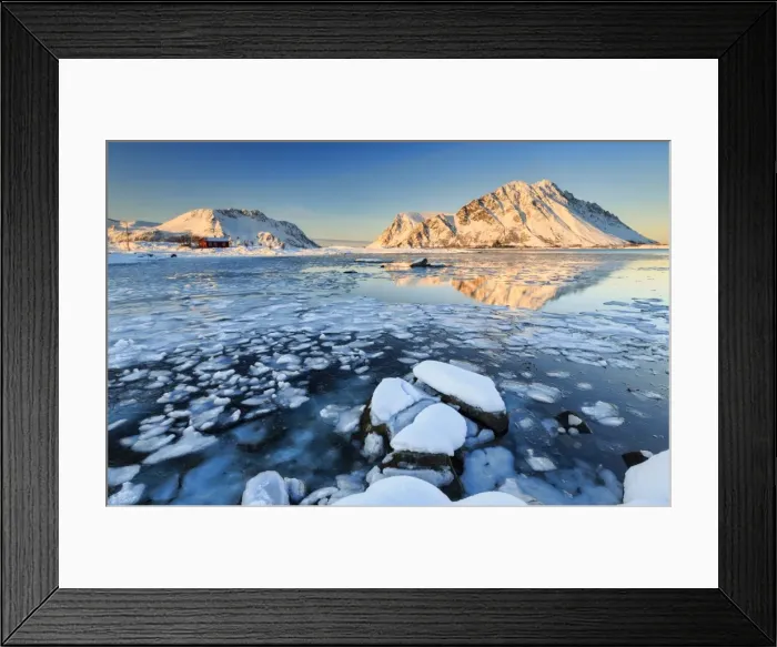 Framed Print : View of the mountains of Gymsoya (Gimsoya) from Smorten reflected in the clear partially frozen sea Framed Print : View of the mountains of Gymsoya (Gimsoya) from Smorten reflected in the clear partially frozen sea