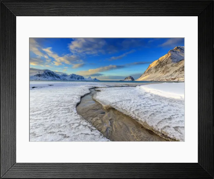 Framed Print : The golden sunrise reflected in a clear stream of the sea where the snow has melted