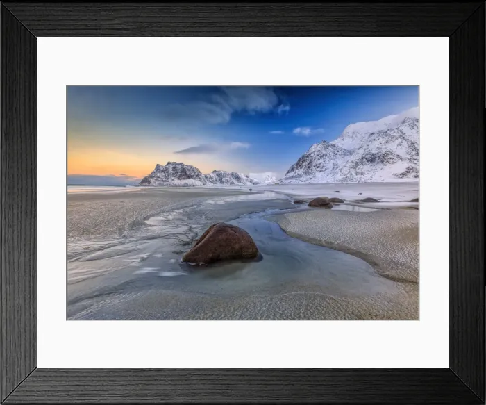 Framed Print : The first light of dawn illuminates the rocks shaped by the wind and the cold sea of Uttakleiv Framed Print : The first light of dawn illuminates the rocks shaped by the wind and the cold sea of Uttakleiv