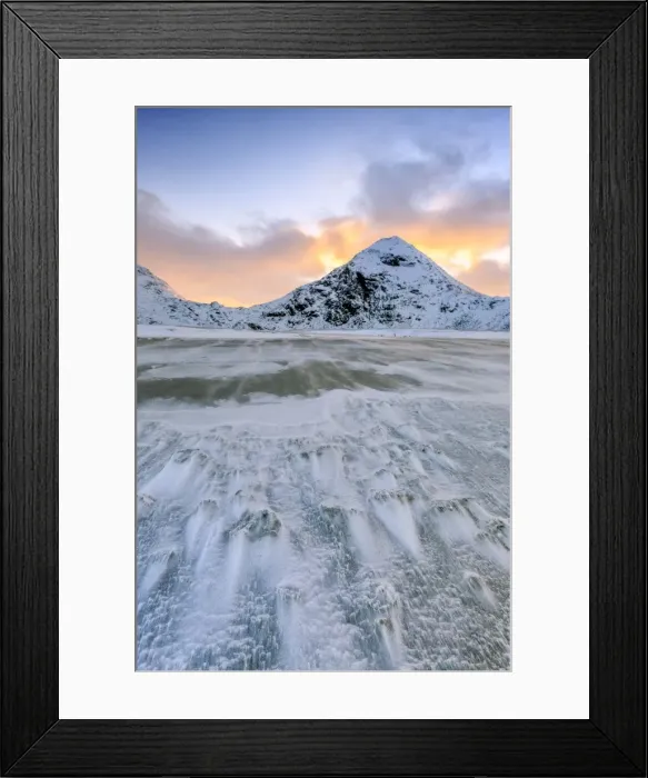 Framed Print : Wave advances towards the shore of the beach surrounded by snowy peaks at dawn, Uttakleiv Framed Print : Wave advances towards the shore of the beach surrounded by snowy peaks at dawn, Uttakleiv