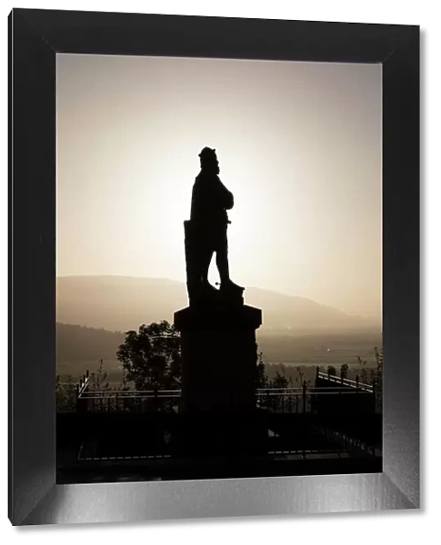 Silhouette of statue of Robert the Bruce at sunrise, Stirling Castle, Scotland, United Kingdom