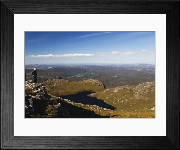 Framed Print : Black Bluff mountain tarn and hiker looking at view, Tasmania, Australia, Pacific Framed Print : Black Bluff mountain tarn and hiker looking at view, Tasmania, Australia, Pacific