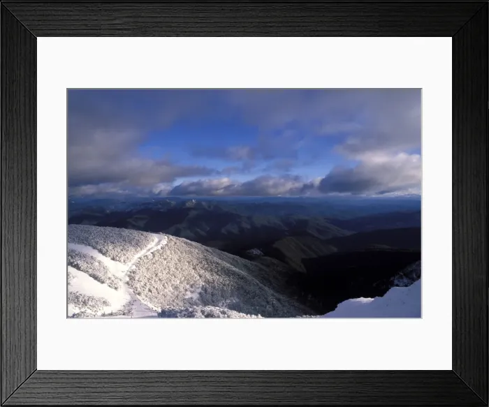 Framed Print : Landscape of snow-covered snow gums, mountainsand clouds, seen from Mount Buller Framed Print : Landscape of snow-covered snow gums, mountainsand clouds, seen from Mount Buller