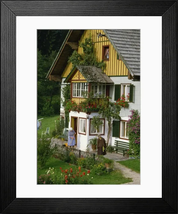 Framed Print : Two ladies outside a typical house with summer flowers in windowboxes and in the garden Framed Print : Two ladies outside a typical house with summer flowers in windowboxes and in the garden