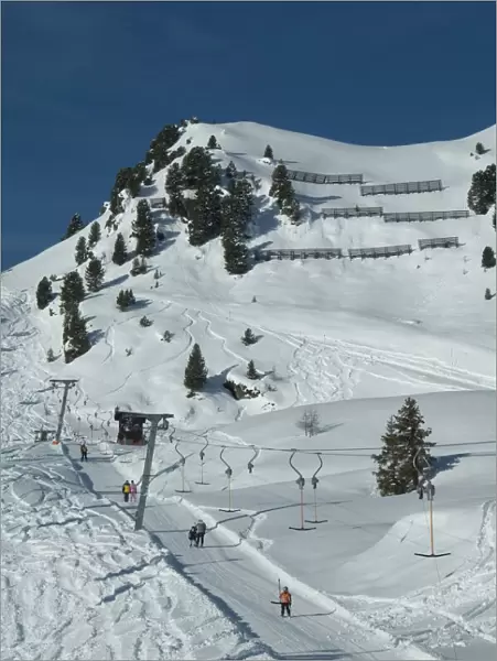 Skiers on ski lift, Mayrhofen ski resort, Zillertal Valley, Austrian Tyrol