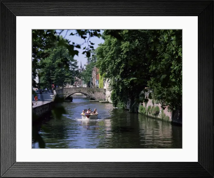 Framed Print : Tourists in boat on canal, Bruges, Belgium, Europe Framed Print : Tourists in boat on canal, Bruges, Belgium, Europe