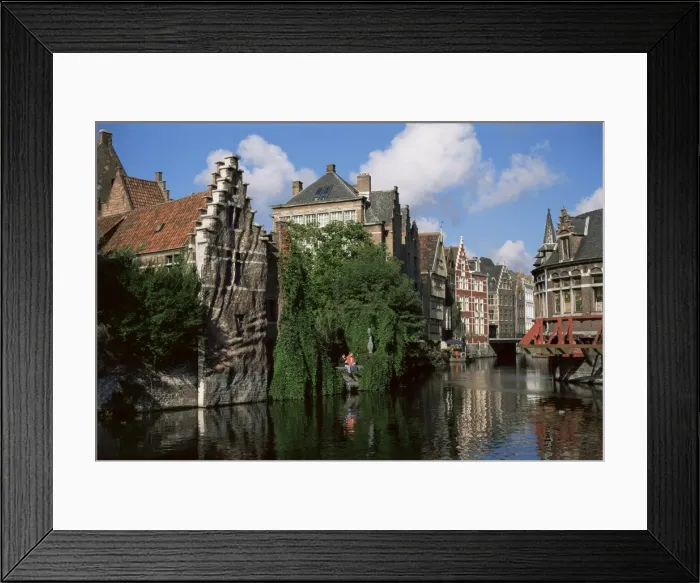 Framed Print : Gabled buildings with distorted facade of bricks, beside old canal, north of the centre of Ghent Framed Print : Gabled buildings with distorted facade of bricks, beside old canal, north of the centre of Ghent