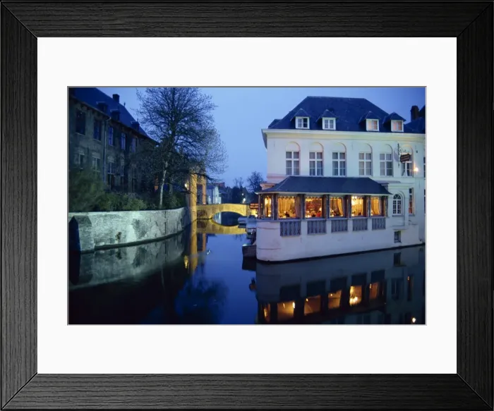 Framed Print : Reflections in the canals of restaurant and bridge, illuminated in the evening Framed Print : Reflections in the canals of restaurant and bridge, illuminated in the evening