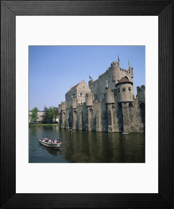 Framed Print : Small tourist boat passing the Castle of the Counts of Flanders in the city of Ghent Framed Print : Small tourist boat passing the Castle of the Counts of Flanders in the city of Ghent