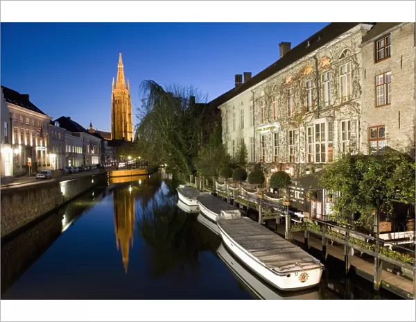 Canal in the evening and Church of our Lady, Bruges, Belgium, Europe