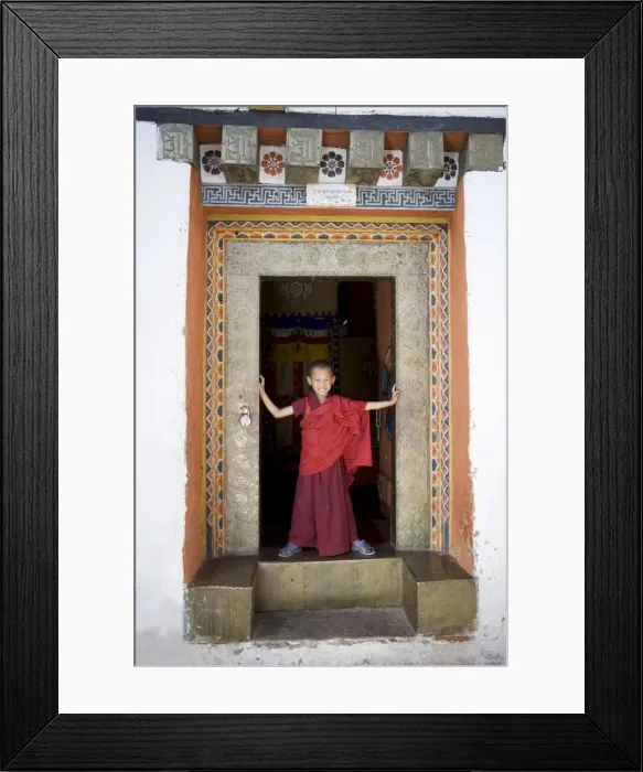 Framed Print : Young Buddhist monk in doorway, Paro Dzong, Paro, Bhutan, Asia Framed Print : Young Buddhist monk in doorway, Paro Dzong, Paro, Bhutan, Asia