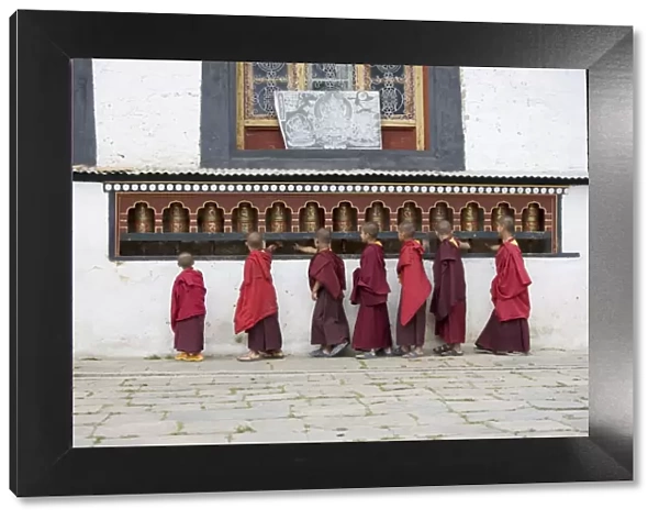 Buddhist monks turning prayer wheels, Karchu Dratsang Monastery, Jankar