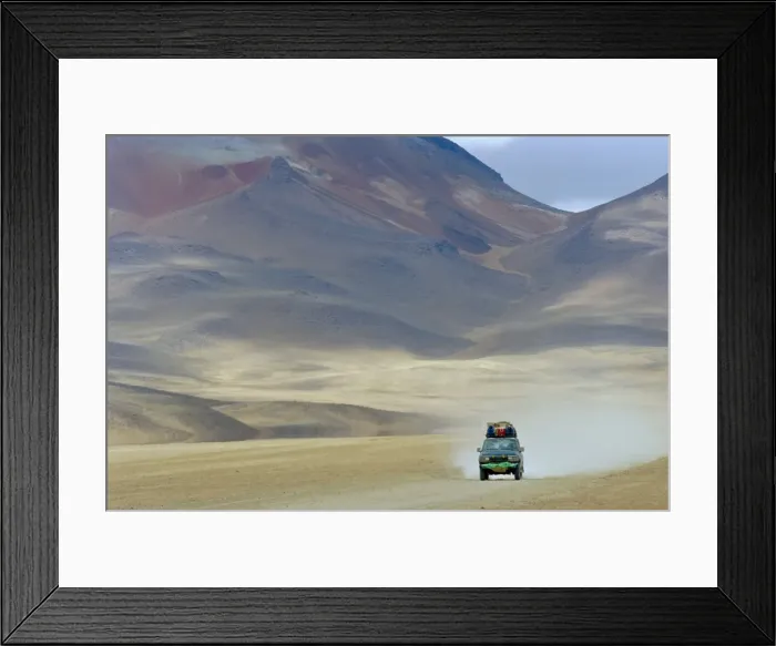 Framed Print : 4 wheel drive car driving through a colourful volcanic landscape near las rocas de Dali