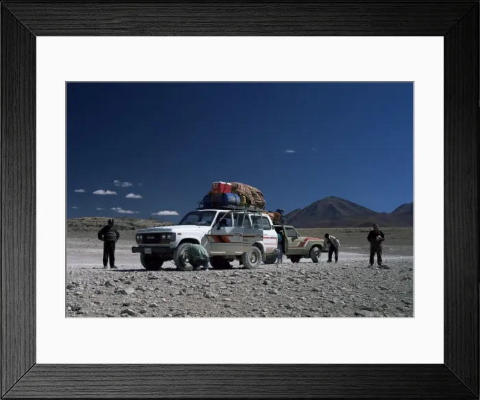 Framed Print : Landcruisers and tourists on jeep tour taking a break on Uyuni salt flat Framed Print : Landcruisers and tourists on jeep tour taking a break on Uyuni salt flat