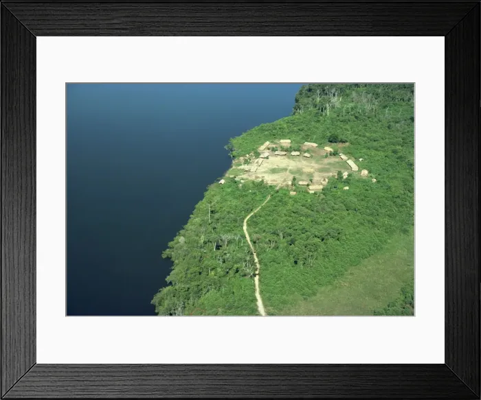 Framed Print : Aerial of a Xingu village and path beside a river in Brazil, South America Framed Print : Aerial of a Xingu village and path beside a river in Brazil, South America