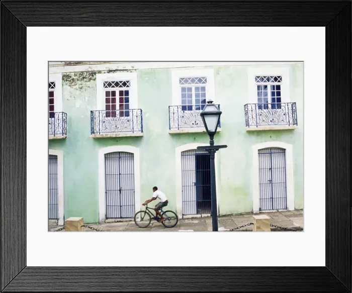 Framed Print : Man riding bicycle in front of old colonial house, Sao Luis, Maranhao, Brazil Framed Print : Man riding bicycle in front of old colonial house, Sao Luis, Maranhao, Brazil