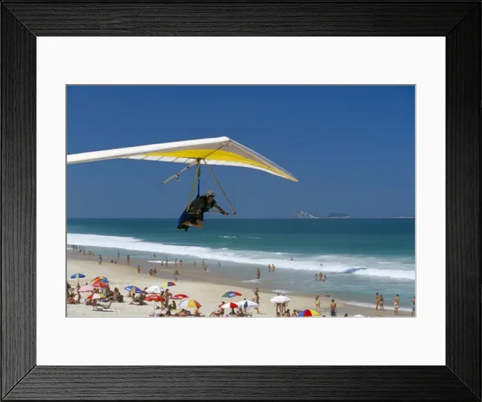 Framed Print : Hang-glider landing on Pepino beach, Rio de Janeiro, Brazil, South America Framed Print : Hang-glider landing on Pepino beach, Rio de Janeiro, Brazil, South America