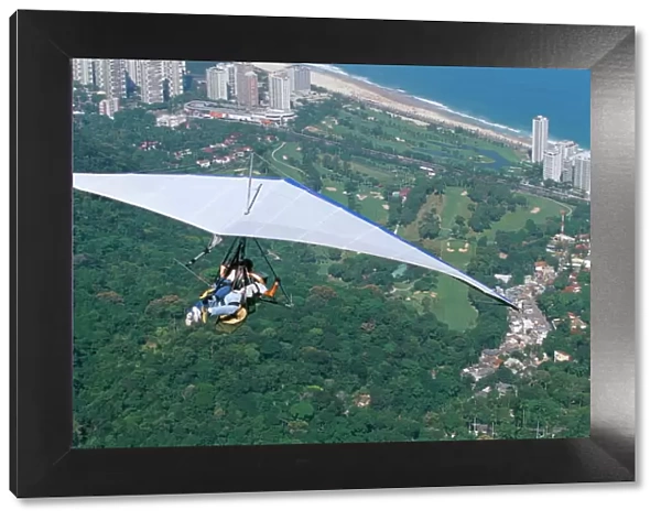 Hang-glider after taking off from Pedra Bonita, Rio de Janeiro, Brazil, South America