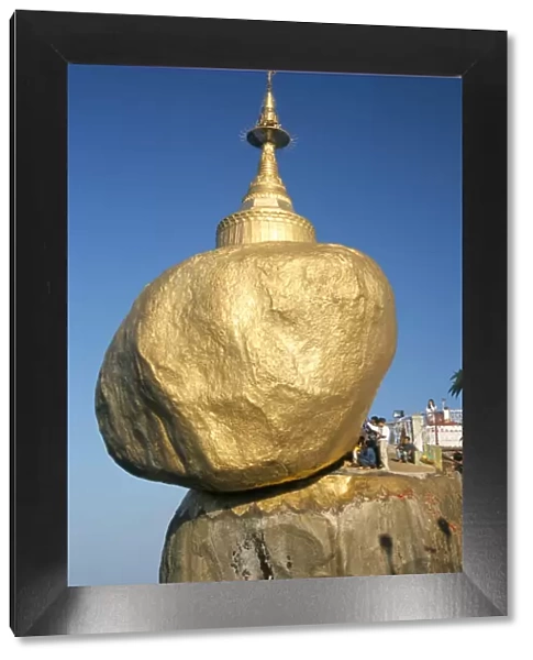 Balanced rock covered in gold leaf, major Buddhist stupa and pilgrim site