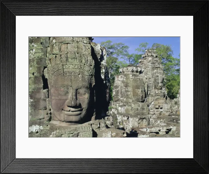 Framed Print : Myriad stone heads typifying Cambodia, the Bayon Temple, Angkor, Siem Reap Framed Print : Myriad stone heads typifying Cambodia, the Bayon Temple, Angkor, Siem Reap
