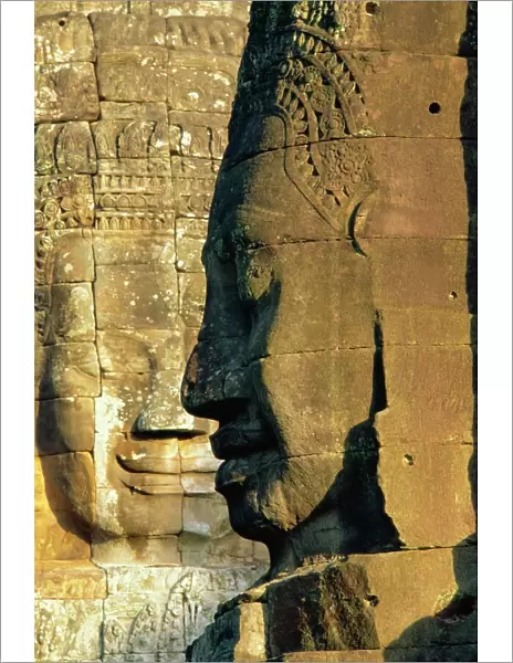 Stone heads typifying Cambodia on the Bayon Temple at Angkor Wat, Siem Reap