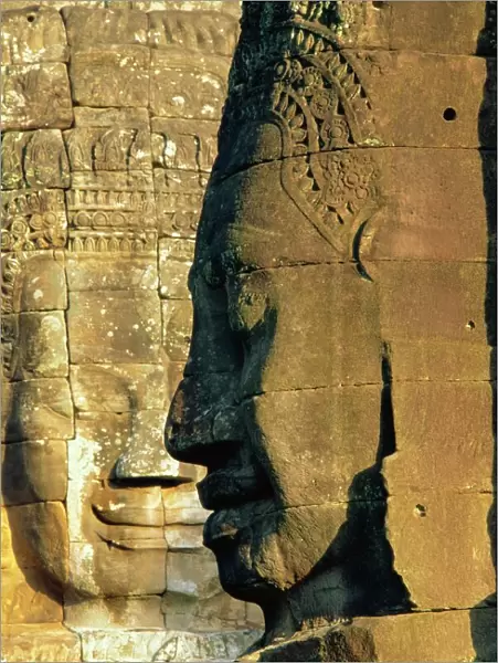 Stone heads typifying Cambodia on the Bayon Temple at Angkor Wat, Siem Reap
