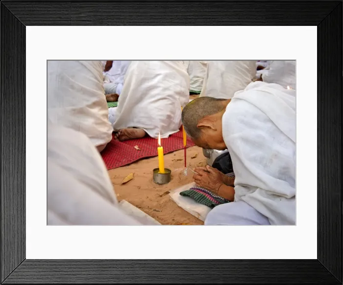 Framed Print : A Buddhist nun prays during a ceremony amongst the temples of Angkor, Cambodia Framed Print : A Buddhist nun prays during a ceremony amongst the temples of Angkor, Cambodia