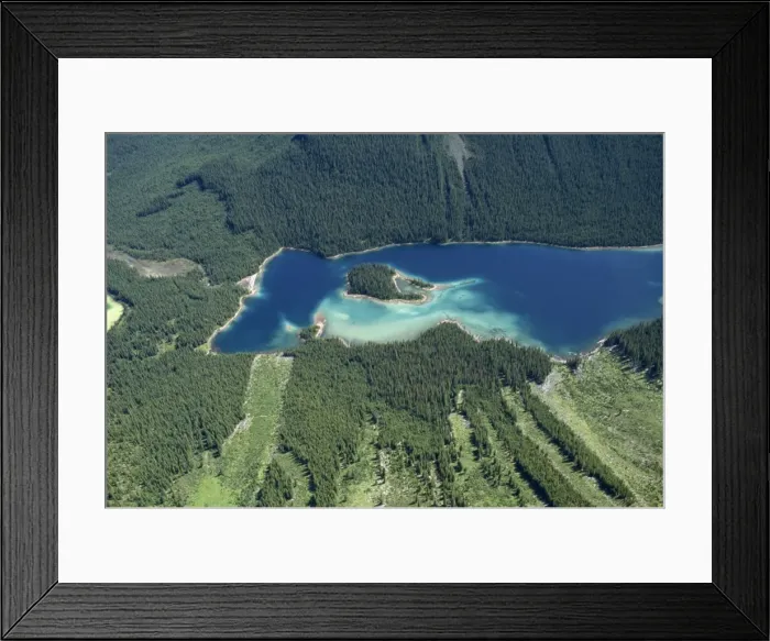 Framed Print : Lake in Rocky Mountains near Banff, with avalanche damage visible in bottom half of picture Framed Print : Lake in Rocky Mountains near Banff, with avalanche damage visible in bottom half of picture