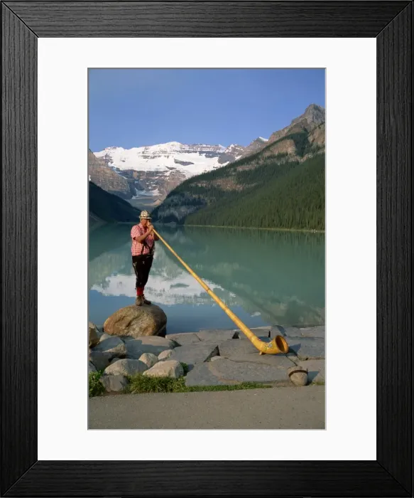 Framed Print : Man with an alpenhorn beside Lake Louise in the Banff National Park, Alberta Framed Print : Man with an alpenhorn beside Lake Louise in the Banff National Park, Alberta