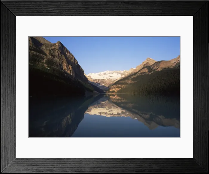 Framed Print : View to Mount Victoria across the still waters of Lake Louise, at sunrise in summer Framed Print : View to Mount Victoria across the still waters of Lake Louise, at sunrise in summer