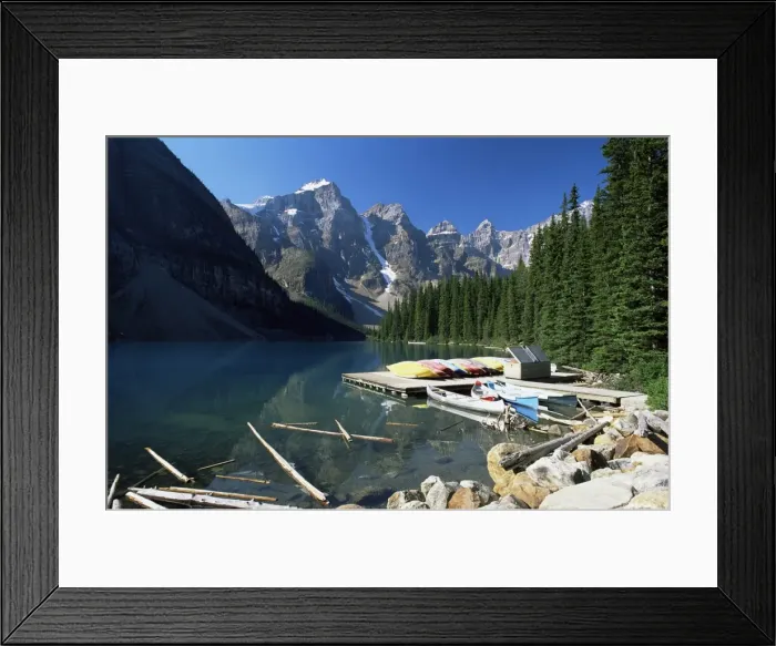 Framed Print : Canoes for hire on shore of Moraine Lake, with view to the Wenkchemna Peaks Framed Print : Canoes for hire on shore of Moraine Lake, with view to the Wenkchemna Peaks