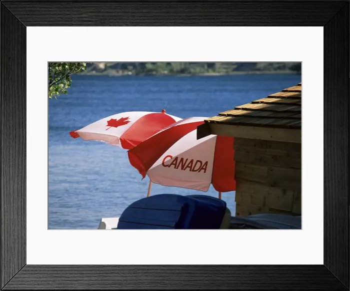 Framed Print : Patriotic umbrellas on the shore of Okanagan Lake, Sun-Oka Beach Provincial Park Framed Print : Patriotic umbrellas on the shore of Okanagan Lake, Sun-Oka Beach Provincial Park