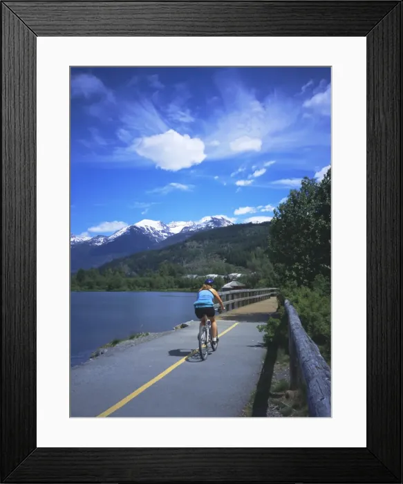 Framed Print : Cyclist on Valley Trail in summer beside Green Lake in the Whistler valley Framed Print : Cyclist on Valley Trail in summer beside Green Lake in the Whistler valley