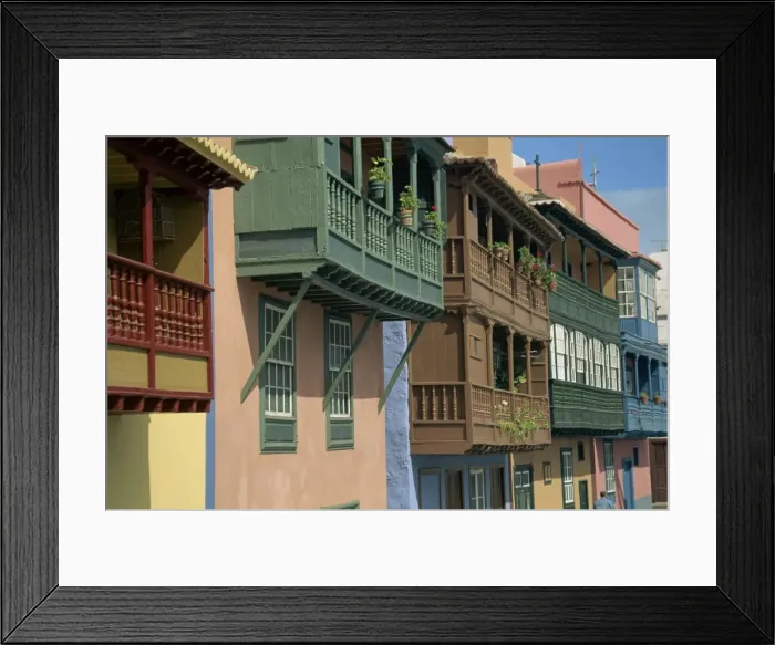 Framed Print : Facades of painted houses with overhanging wooden balconies in Santa Cruz de la Palma Framed Print : Facades of painted houses with overhanging wooden balconies in Santa Cruz de la Palma