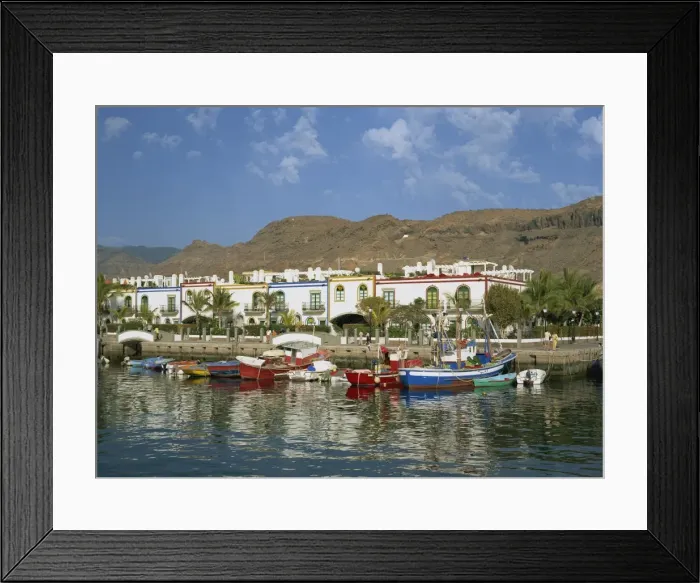 Framed Print : Colourful fishing boats and cottages in the old port area, Puerto de Morgan Framed Print : Colourful fishing boats and cottages in the old port area, Puerto de Morgan