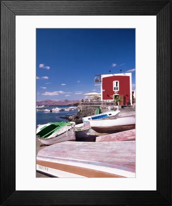 Framed Print : Boats and old red house in the old harbour, Puerto del Carmen, Lanzarote Framed Print : Boats and old red house in the old harbour, Puerto del Carmen, Lanzarote