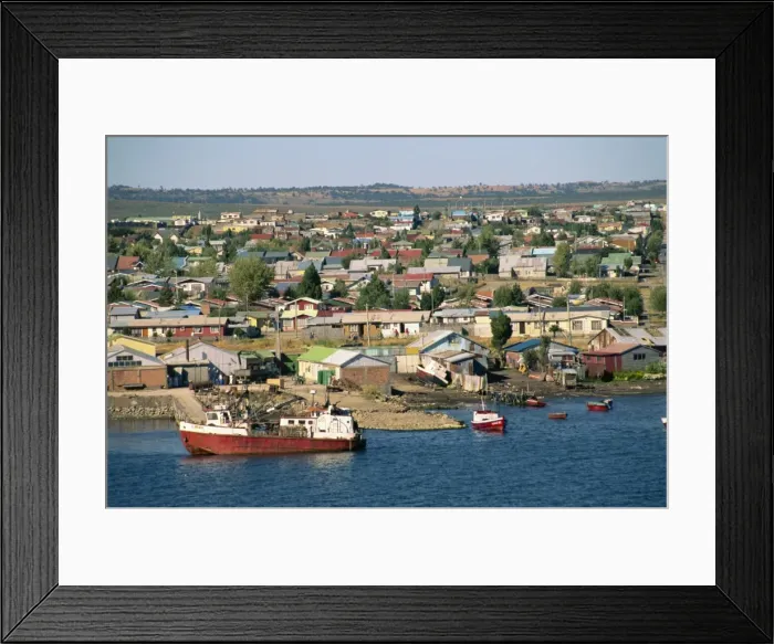 Framed Print : Boats on the waterfront and the town of Puerto Natales, in Magallanes, Chile Framed Print : Boats on the waterfront and the town of Puerto Natales, in Magallanes, Chile