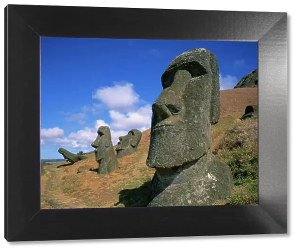 Moai statues carved from crater walls, on the southern slopes of Volcan Rano Raraku