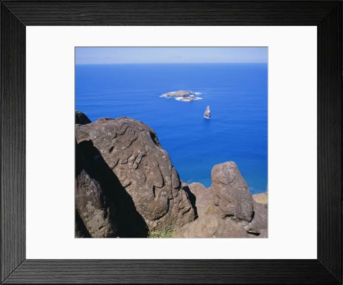 Framed Print : Birdman Petroglyphs at Orongo, the ceremonial village on Ranocau Crater rim; bird islands offshore are Motu Kao Kao, Motu Iti and Motu Nui, Easter Framed Print : Birdman Petroglyphs at Orongo, the ceremonial village on Ranocau Crater rim; bird islands offshore are Motu Kao Kao, Motu Iti and Motu Nui, Easter