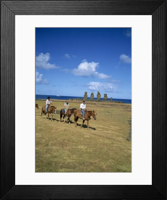Framed Print : Tourists on horseback touring sites of moai or statues, at Ahu Vai Uri on Easter Island