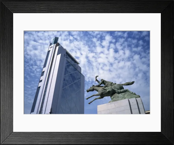 Framed Print : Modern skyscraper and statue show contrast of the old and the new, Santiago Framed Print : Modern skyscraper and statue show contrast of the old and the new, Santiago