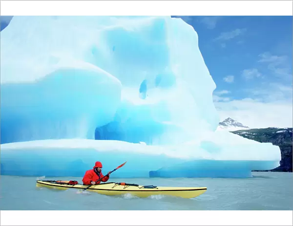 Person kayaking near floating icebergs, Lago Gray (Lake Gray), Torres del Paine National Park