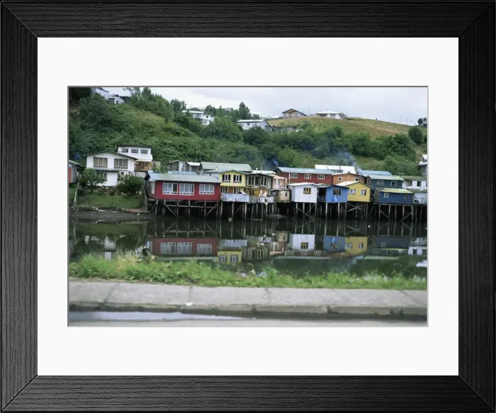 Framed Print : Houses on stilts reflected in the water, Palafitos, Castro, Chiloe Island Framed Print : Houses on stilts reflected in the water, Palafitos, Castro, Chiloe Island