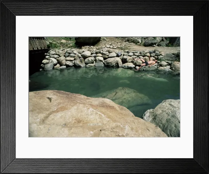 Framed Print : Tourist sunbathing after soaking in hot springs of Los Pozones, Chile, South America Framed Print : Tourist sunbathing after soaking in hot springs of Los Pozones, Chile, South America