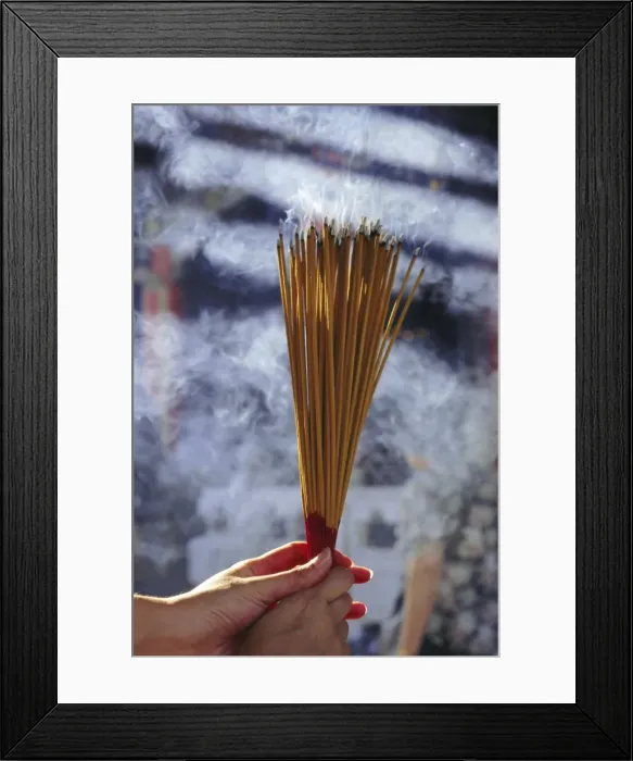Framed Print : Hand holding incense, Hong Kong, China, Asia Framed Print : Hand holding incense, Hong Kong, China, Asia