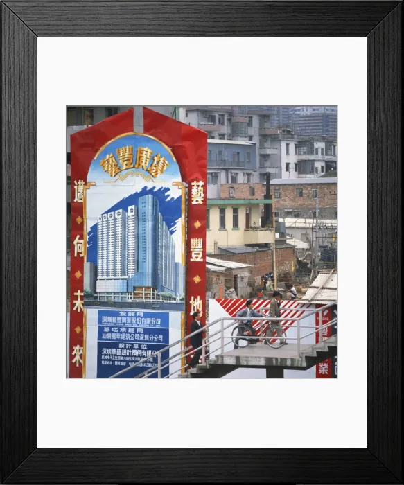 Framed Print : Sign showing modern buildings in front of old huts and apartment blocks in the Shenzhen Development Zone, Guangdong Framed Print : Sign showing modern buildings in front of old huts and apartment blocks in the Shenzhen Development Zone, Guangdong