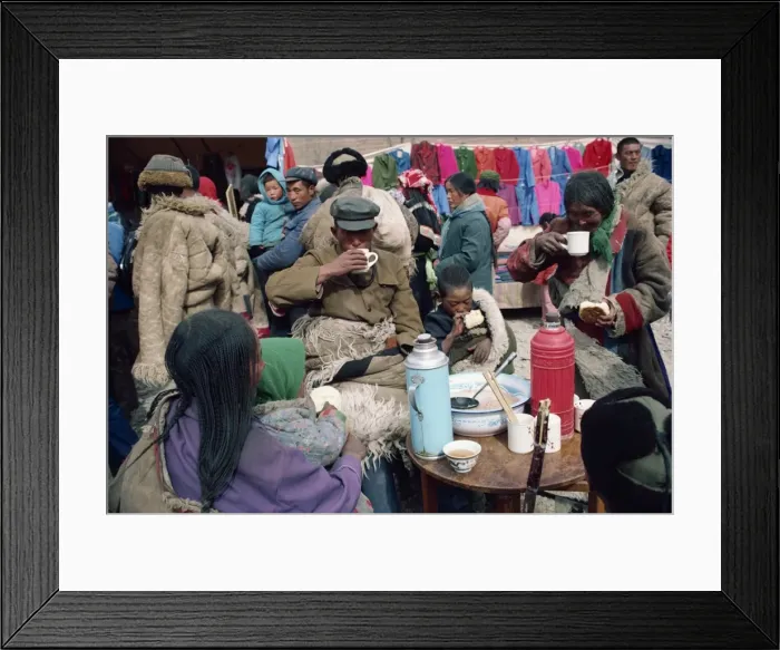 Framed Print : A group of Tibetans eating at the bazaar at T'Aer Monastery, Qinghai province Framed Print : A group of Tibetans eating at the bazaar at T'Aer Monastery, Qinghai province