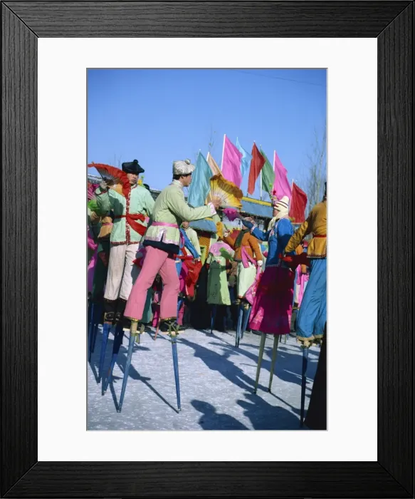 Framed Print : Crowds of stilt dancers celebrate Chinese New Year, China, Asia Framed Print : Crowds of stilt dancers celebrate Chinese New Year, China, Asia