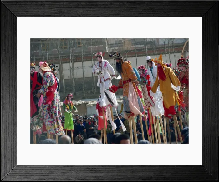 Framed Print : Stilt dancers in parade at New Year celebrations in Qinghai Province, China, Asia Framed Print : Stilt dancers in parade at New Year celebrations in Qinghai Province, China, Asia