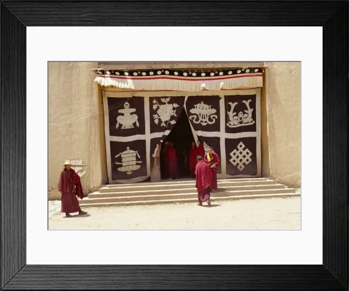 Framed Print : Lamas at monastery entrance, which is covered with a curtain depicting the sacred symbols of Buddhism, at Longki, south of Yushu in Qinghai Framed Print : Lamas at monastery entrance, which is covered with a curtain depicting the sacred symbols of Buddhism, at Longki, south of Yushu in Qinghai